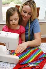 Child Learning To Sew