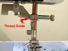 thread guide on a sewing machine